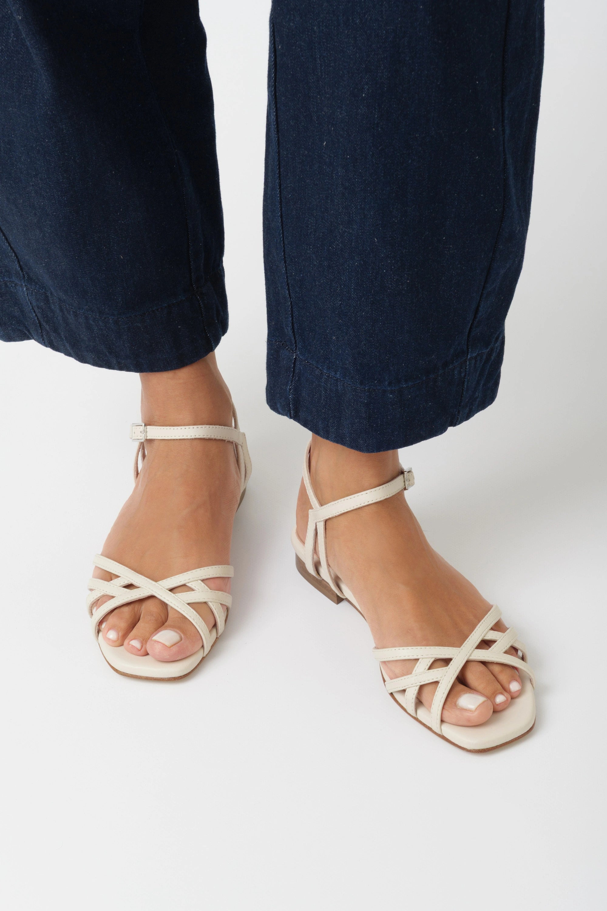 Butter nappa flat sandal with criss-cross straps and low ankle strap