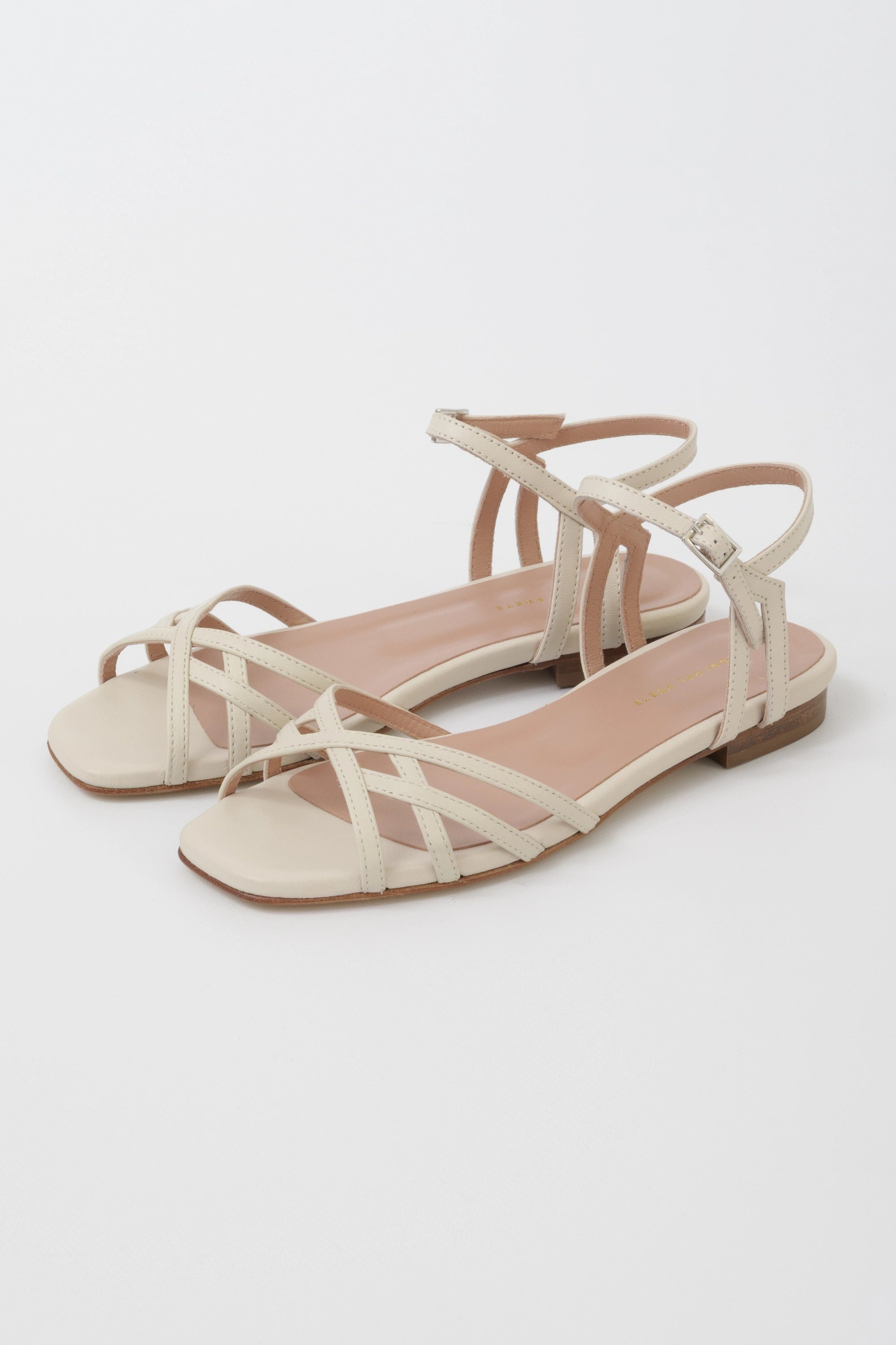 Butter nappa flat sandal with criss-cross straps and low ankle strap
