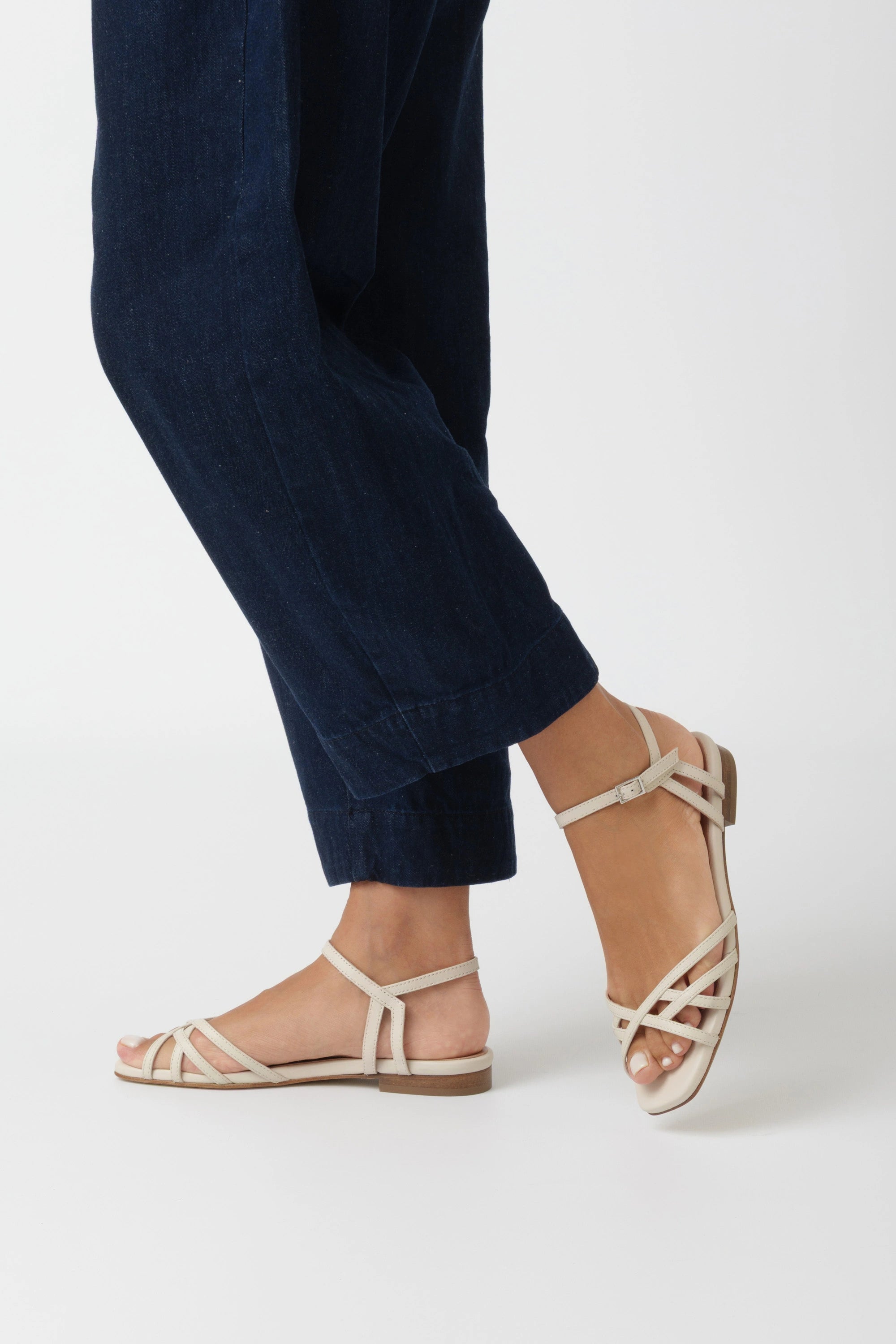 Butter nappa flat sandal with criss-cross straps and low ankle strap